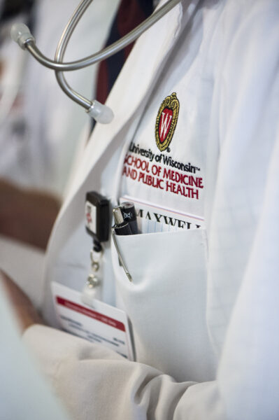 Image of a person wearing a SMPH lab coat
